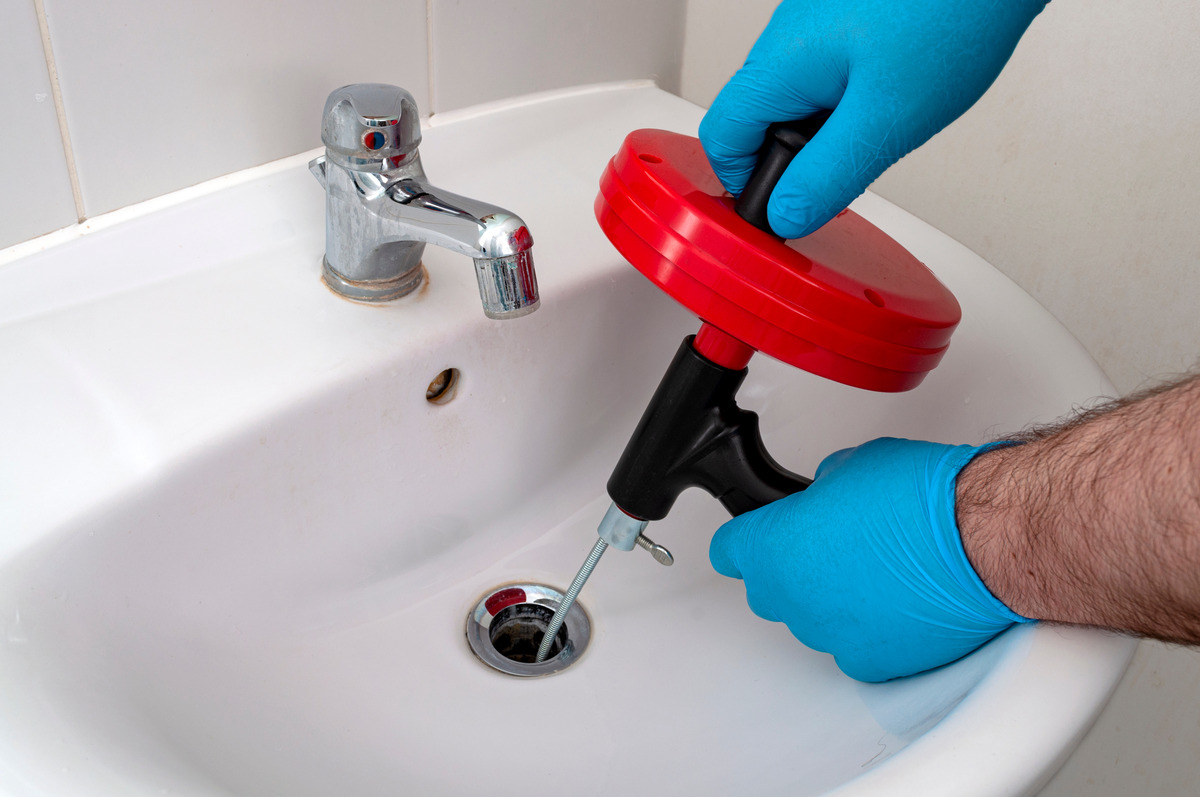 Kitchen drain being fixed