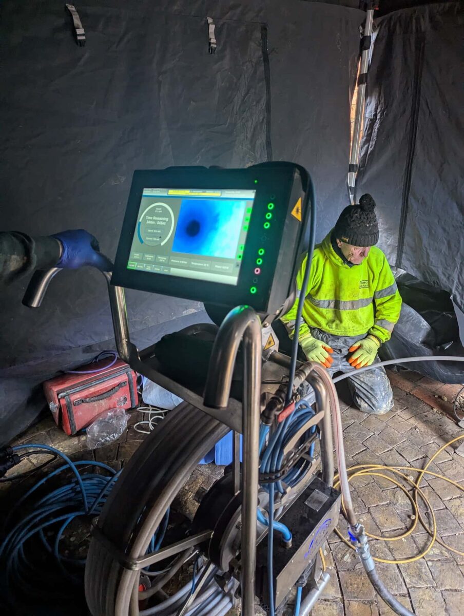 Blue light lining repair on broken drain