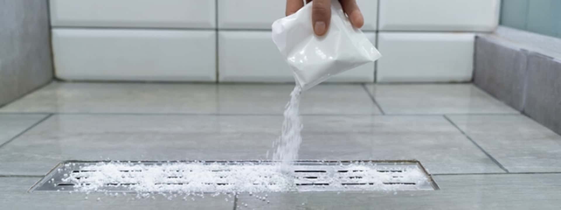 Cleaning drains with powdered unblocking products