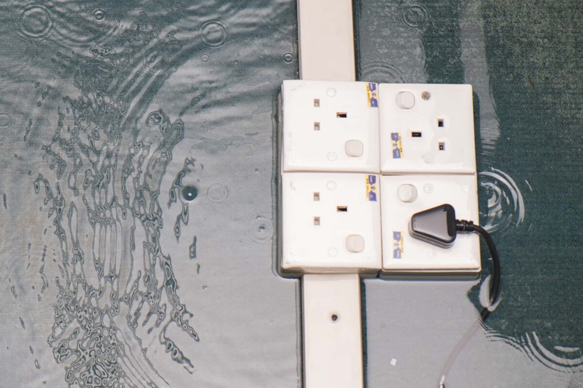 Electric outlets surrounded by flooded water