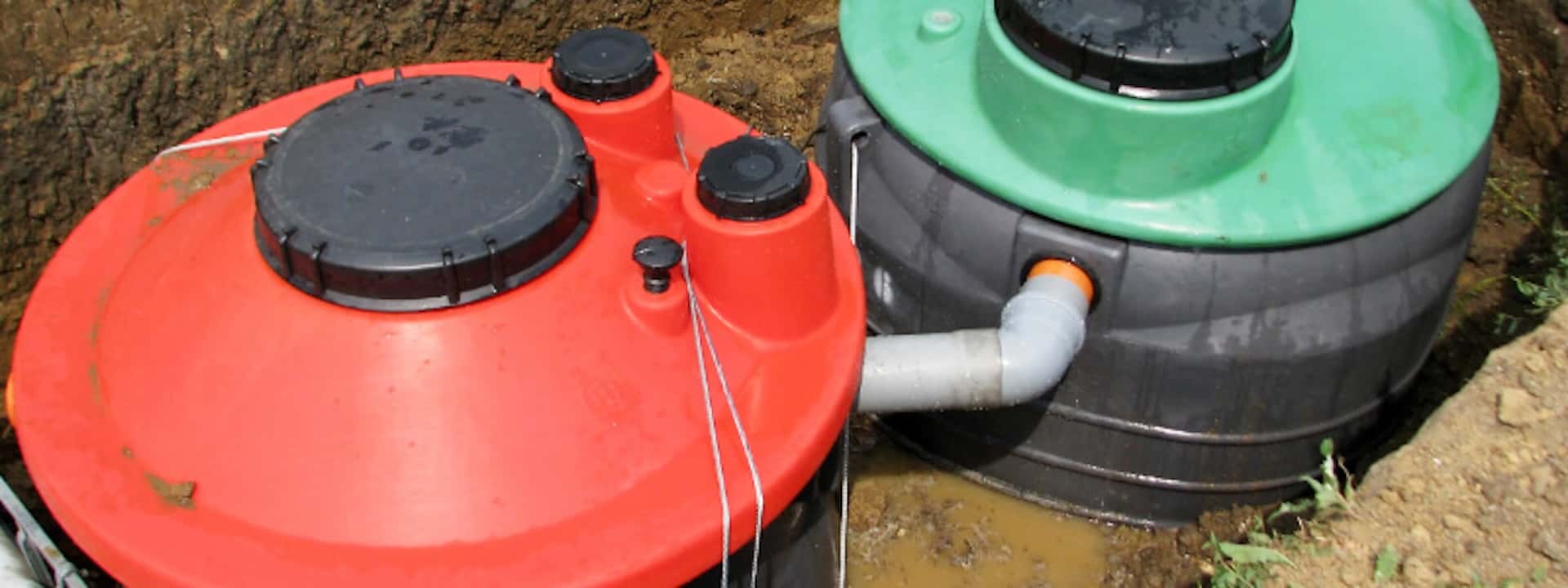 Two connected septic tanks during installation