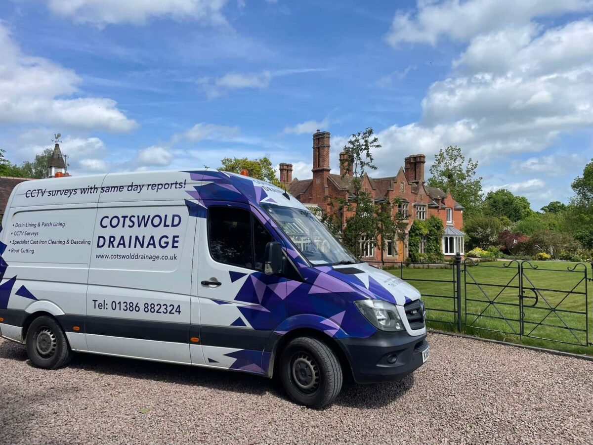 Cotswold Drainage van outside a nice home